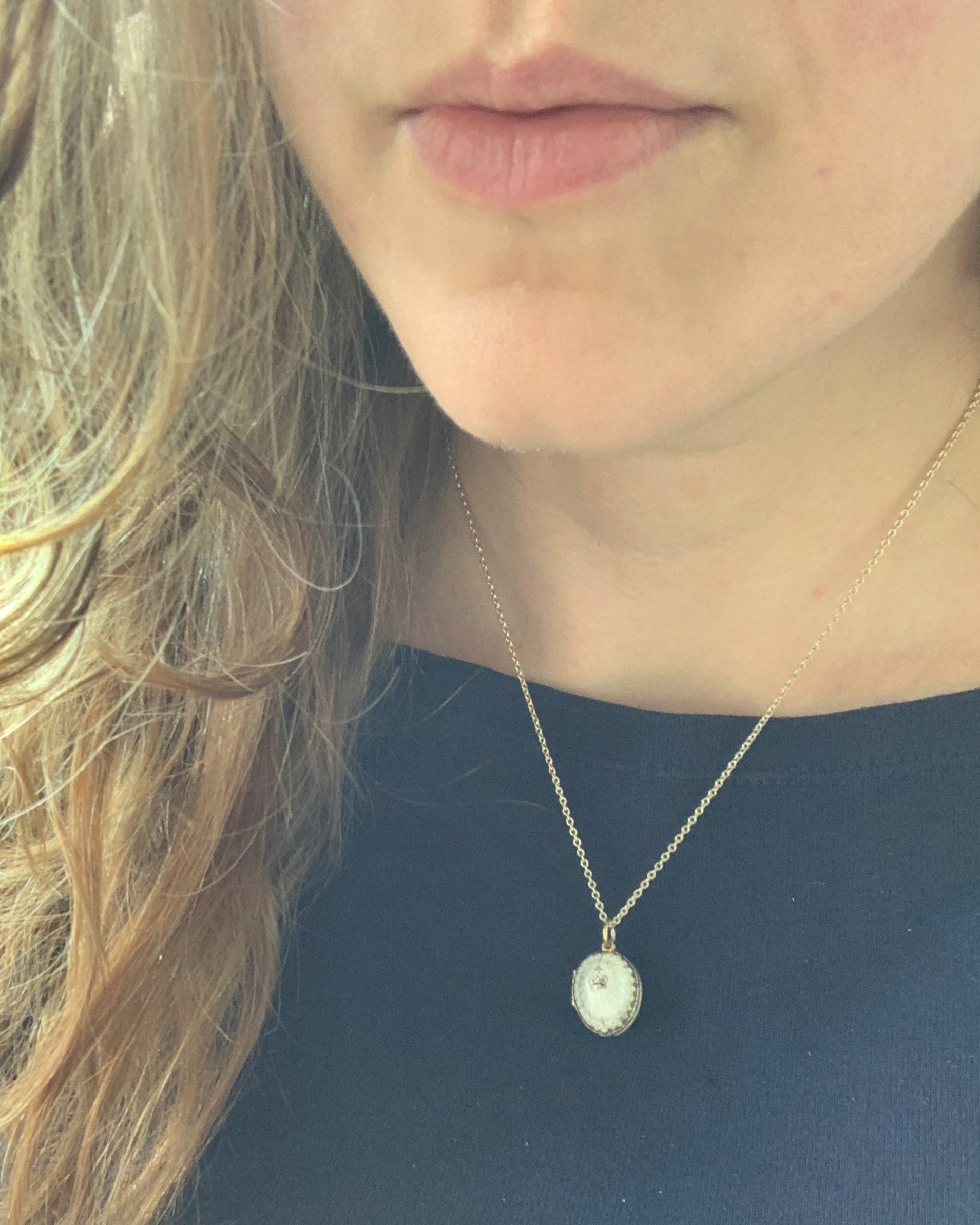 White enamel silver egg pendant
